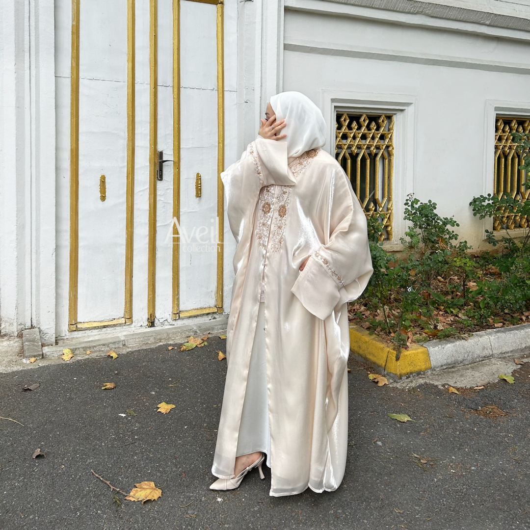 Astera Luxury Abaya made in a Bahraini cut that is stunning and elegant. The material used is Luxury Organza and comes in Size 54, 56 and 58. The colour is Ivory or Off-White.