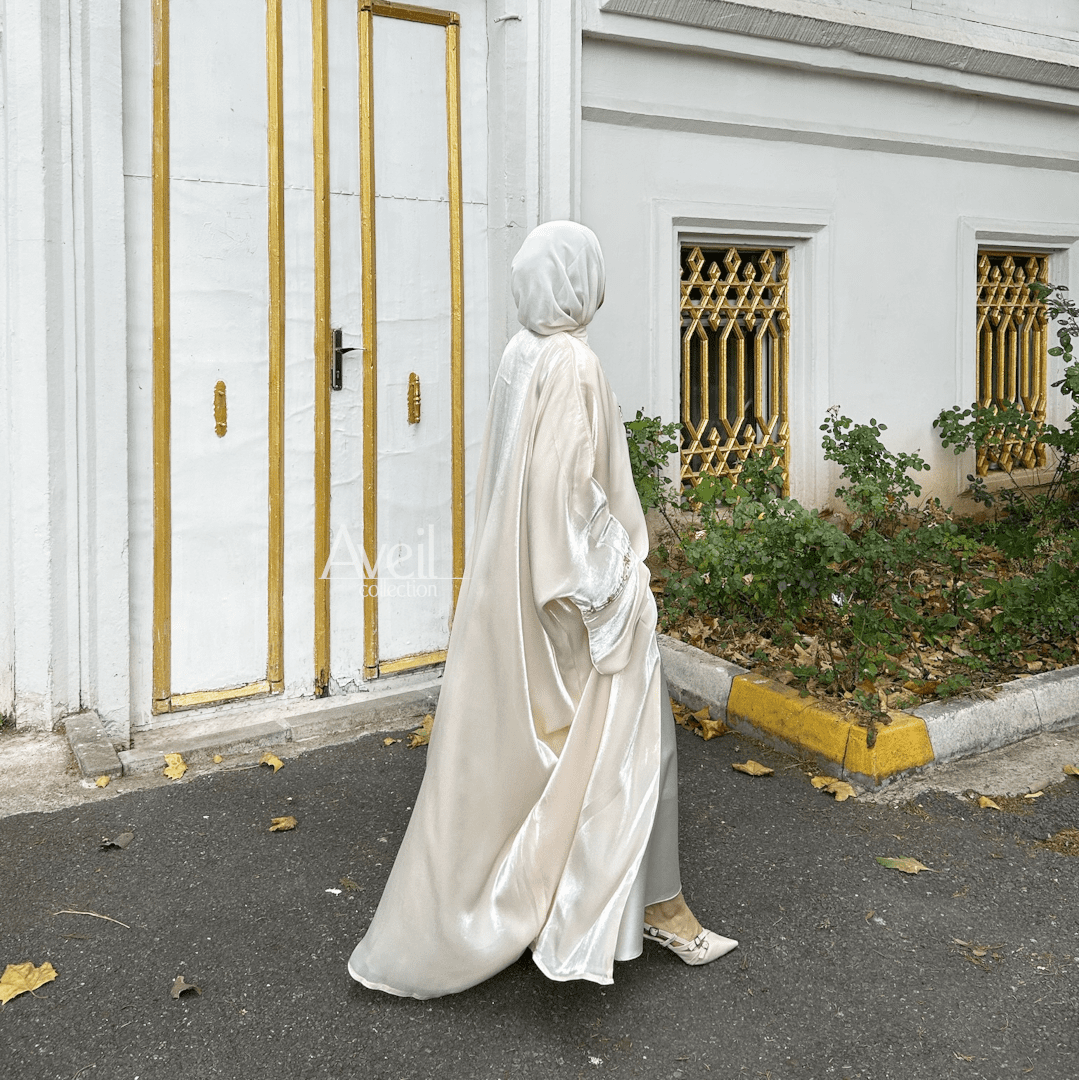 Astera Luxury Abaya made in a Bahraini cut that is stunning and elegant. The material used is Luxury Organza and comes in Size 54, 56 and 58. The colour is Ivory or Off-White.
