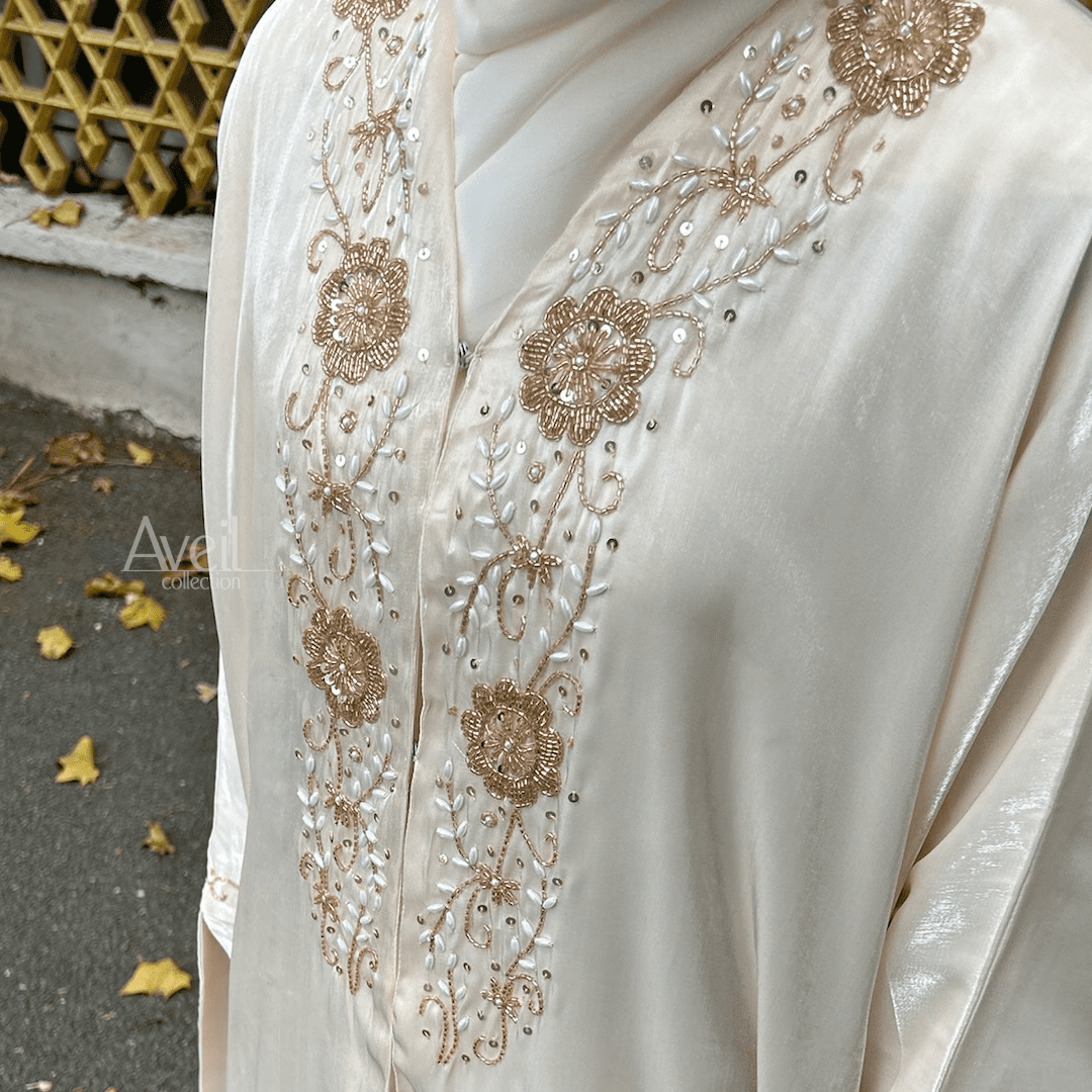Astera Luxury Abaya made in a Bahraini cut that is stunning and elegant. The material used is Luxury Organza and comes in Size 54, 56 and 58. The colour is Ivory or Off-White.
