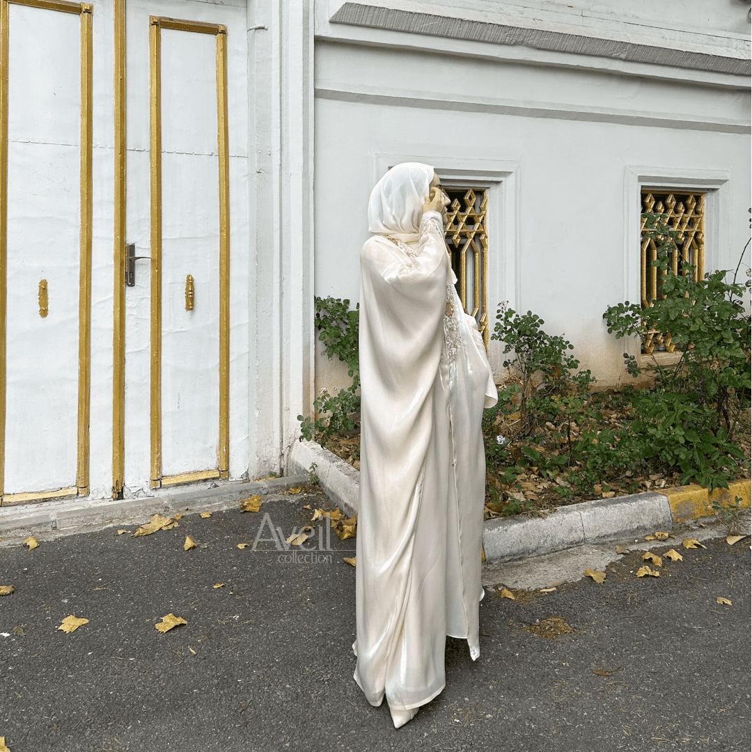Astera Luxury Abaya made in a Bahraini cut that is stunning and elegant. The material used is Luxury Organza and comes in Size 54, 56 and 58. The colour is Ivory or Off-White.