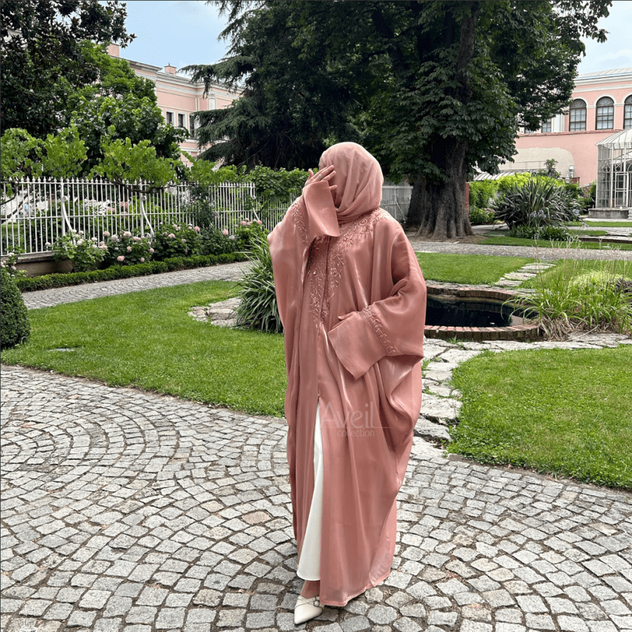 Nyssa Luxury Abaya made in a Bahraini cut that is stunning and elegant. The material used is Luxury Organza and comes in Size 54, 56 and 58. The colour is Pink.
