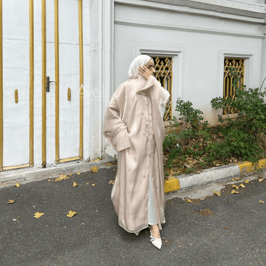 Rosidae Luxury Abaya made in a Bahraini cut that is stunning and elegant. The material used is Luxury Organza and comes in Size 54, 56 and 58. The colours are Beige and Jade.