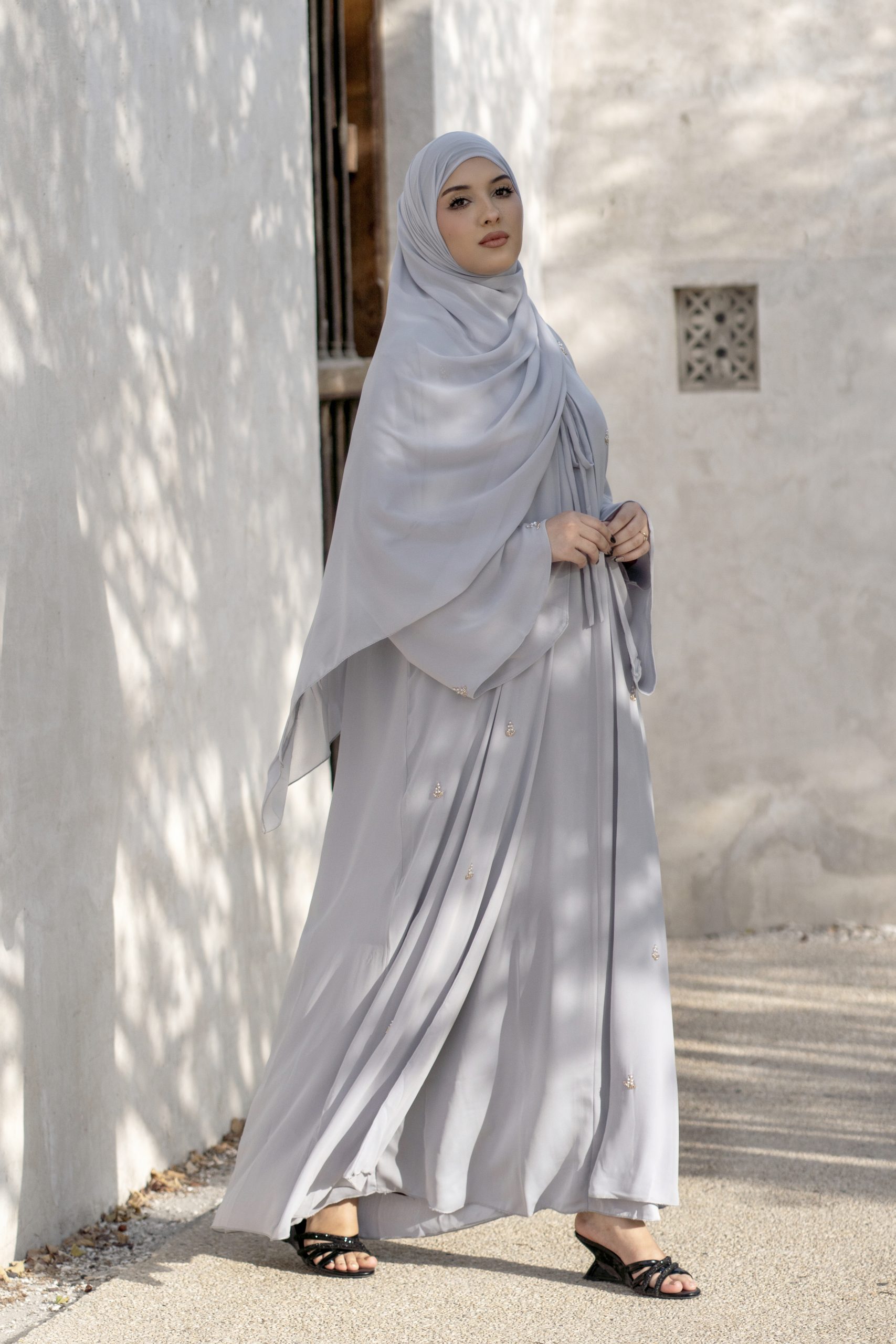 Ela Collection — Luxury 3-Piece Abaya Set A stunning wide A-line silhouette with enchanting butterfly sleeves, crafted from exquisitely soft chiffon. Adorned with intricate beadwork floral motifs for a touch of refined elegance.