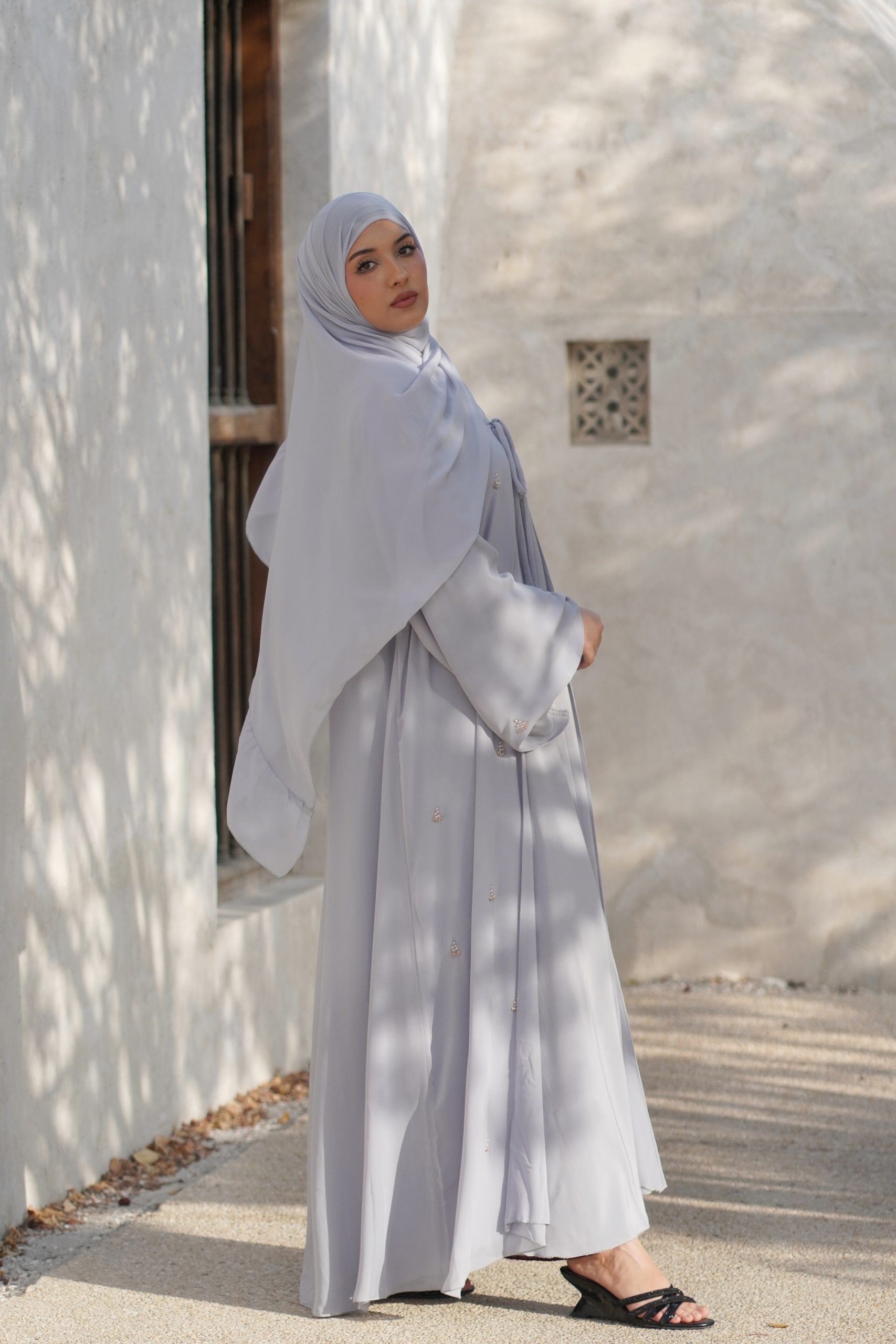 Ela Collection — Luxury 3-Piece Abaya Set A stunning wide A-line silhouette with enchanting butterfly sleeves, crafted from exquisitely soft chiffon. Adorned with intricate beadwork floral motifs for a touch of refined elegance.