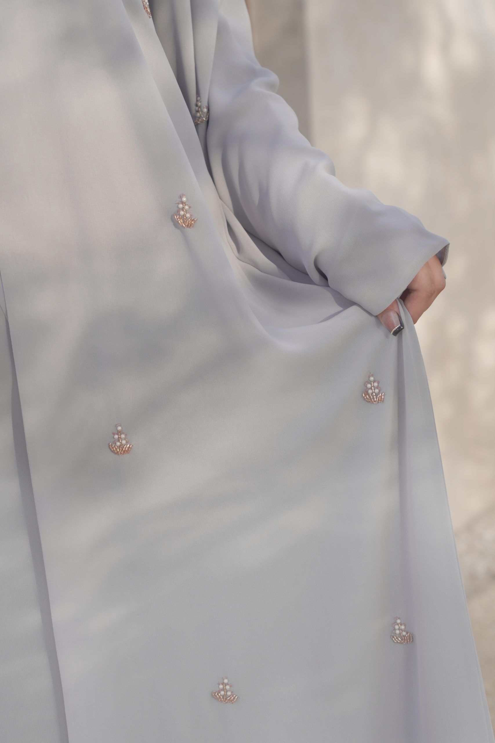 Ela Collection — Luxury 3-Piece Abaya Set A stunning wide A-line silhouette with enchanting butterfly sleeves, crafted from exquisitely soft chiffon. Adorned with intricate beadwork floral motifs for a touch of refined elegance.