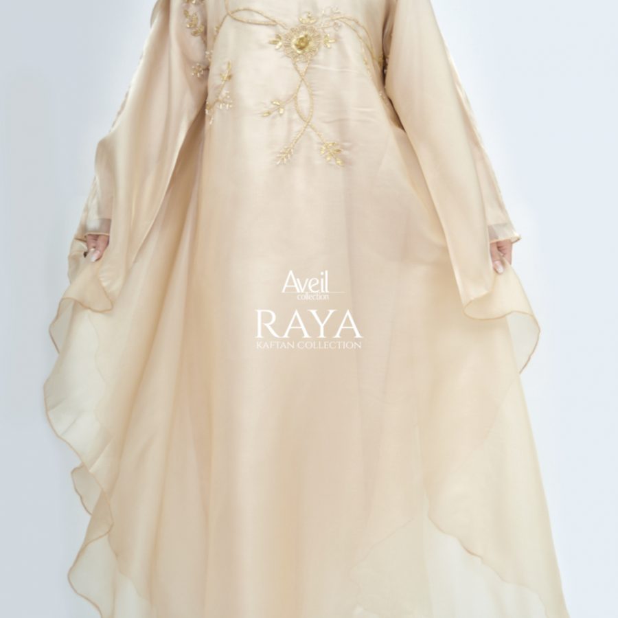 Model wearing Raya Luxury Closed Kaftan Abaya in satin with batwing silhouette and gold pearl embroidery